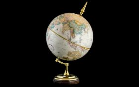 A 12" World Classic Series Globe, made by Replogle Globes Inc, USA. On a brass mount, height 21".