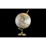 A 12" World Classic Series Globe, made by Replogle Globes Inc, USA. On a brass mount, height 21".