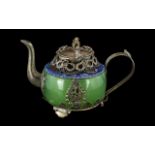 Chinese Silvered Metal Embellished Tea-pot with a jade-stone green body of typical form,