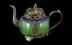 Chinese Silvered Metal Embellished Tea-pot with a jade-stone green body of typical form,