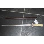 A French Model 1886/93/16 Bayonet, with brass hilt and scabbard.