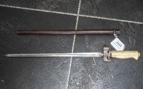 A French Model 1886/93/16 Bayonet, with brass hilt and scabbard.
