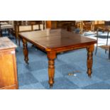 Edwardian Walnut Drawer-Leaf Dining Table, with a wind-out mechanism with two leaves, supported on