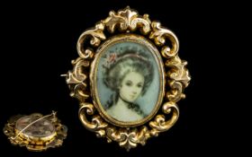 Antique Pinchbeck Brooch, with portrait of an elegant lady, in ornate scroll gold metal surround,