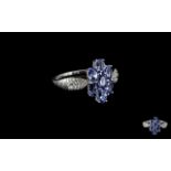 Tanzanite Cluster 9ct White Gold Ring, the centrepiece comprising seven oval cut tanzanites of