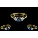 18ct Gold - Attractive 3 Stone Sapphire and Diamond Set Dress Ring.