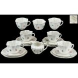 Shelley 19 piece Teaset later painted with floral sprigs.