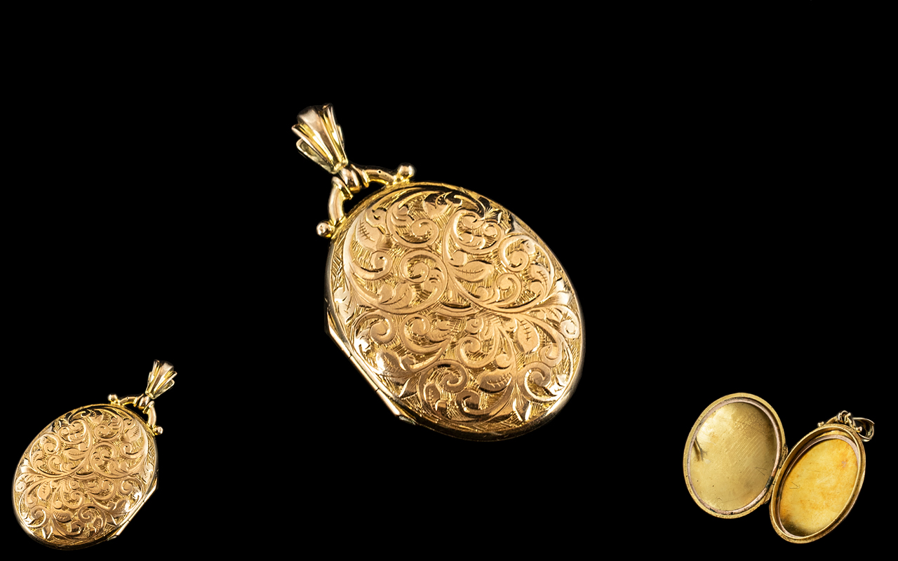 15ct Gold - Attractive Oval Shaped Hinged Locket with Chased Decoration to Front Cover. Marked 15ct.