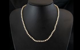 A Single Strand 16 inch Pearl Necklace with 9ct gold clasp.