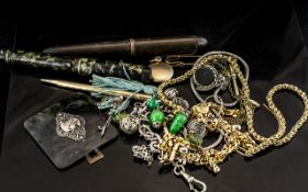 Mixed Bag of Costume Jewellery, old pens, necklaces, bangles and brooches.