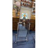 An Art Deco Style Retro Chrome Cheval Mirror, on stand, of rectangular form.