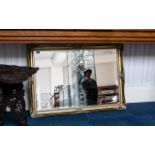 Large Rectangular Gilt Framed Bevelled Glass Mirror, swept moulded frame. Measures 29'' x 40''.