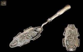 An Antique 19th Century Austrian Fish Slice - Embossed Shell & Floral with Cherub and Sea God.