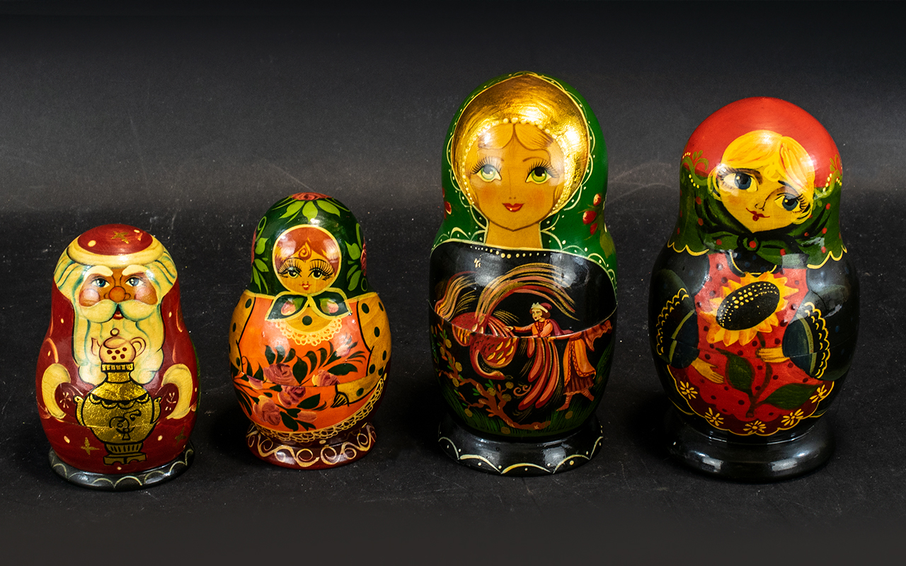 Collection of Four Russian Matryoshka Dolls, comprising a five piece 'Sunflower' design doll 6.