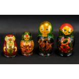 Collection of Four Russian Matryoshka Dolls, comprising a five piece 'Sunflower' design doll 6.