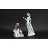 Two Nao Figures, comprising a 7'' tall figure of a seated girl with three rabbits; together with a