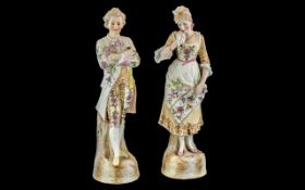 Pair of German Bisque Figures, depicting a lady and gentleman, measure approx 14" tall.