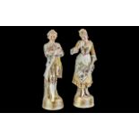 Pair of German Bisque Figures, depicting a lady and gentleman, measure approx 14" tall.