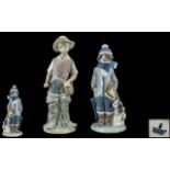 Two Lladro Figures, one 'Boy with Dog' No. 5220.