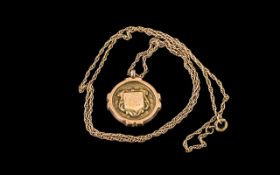 9ct Gold Fob, Chester Hallmark, suspended on a yellow metal chain. Gross weight 7.4 grams.