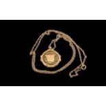 9ct Gold Fob, Chester Hallmark, suspended on a yellow metal chain. Gross weight 7.4 grams.