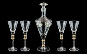 A Modern Glass Decanter Set comprising of a decanter of tapering form and four glasses with gilt