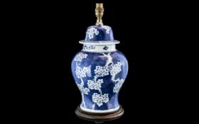 Antique Chinese Blue & White Lamp on wooden base. 14" in height.