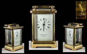 French Brass Carriage Clock with Carrying Handle of Traditional Shaped with Glass Sides and Back.