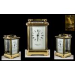 French Brass Carriage Clock with Carrying Handle of Traditional Shaped with Glass Sides and Back.