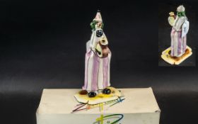 Zampiva Clown Figure holding a drum, in original box, measures 7.5" tall.