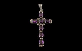 Large Silver & Amethyst Cross, set with seven large cut amethysts. Measures 3" x 1.25".