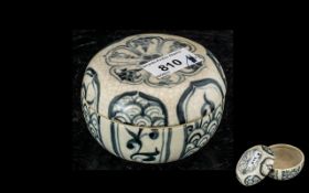 An Antique Chinese Lidded Box, with underglazed blue decoration and crackle finish. 4'' diameter.