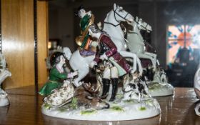 A Continental Porcelain Figural Group 'The Hunt', a mounted horn blower,