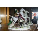 A Continental Porcelain Figural Group 'The Hunt', a mounted horn blower,