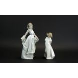 Two Nao Figures, comprising: a young lady with a shawl, 10'' tall; and a figure of a young child 8''