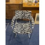 A Pel Chrome Cantilever Baushause Style Armchair. Covered in zebra print fabric.