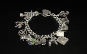 Vintage Sterling Silver Charm Bracelet Loaded with 14 Silver Charms. Both Bracelet and Charms Marked