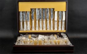 Canteen of Cutlery by Arthur Price of England, complete with guarantee and housed in a mahogany box.