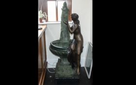 20th Century Large Bronze Fountain depicting a semi-clad maiden drinking from the fountain whilst