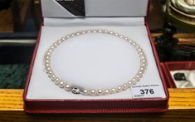 Elegant Set of Balanced Cultured Pearls of Lustrous Colour by Temples, In Red Leather Fitted Box.