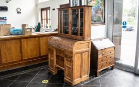 A Small Golden Oak Tambour Fronted Fitted Roll Top Desk, with a matching leaded glass cupboard