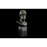 Small Bronzed Metal German Figure of a Helmeted Soldier In an Heroic Pose,
