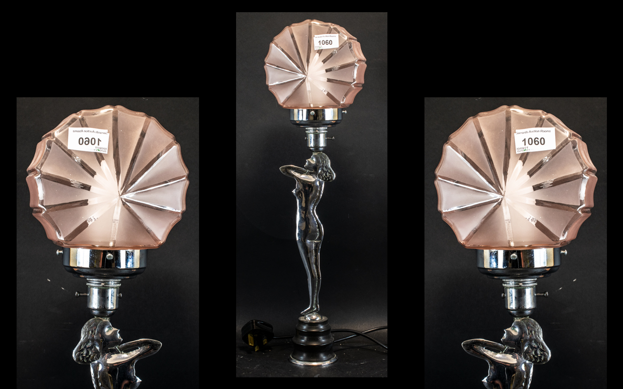 An Art Deco Period Chrome Lamp in the shape of a lady,