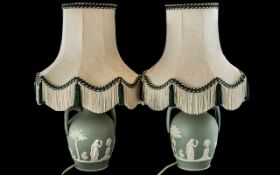 Pair of Wedgwood Table Lamps decorated with Neo classical scenes, embossed decoration to base.