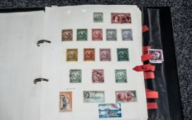 Black Two Ring Stamp Album with superb collection of British Commonwealth stamps.