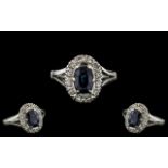 Ladies 18ct White Gold Attractive Diamond and Sapphire Set Cluster Ring.