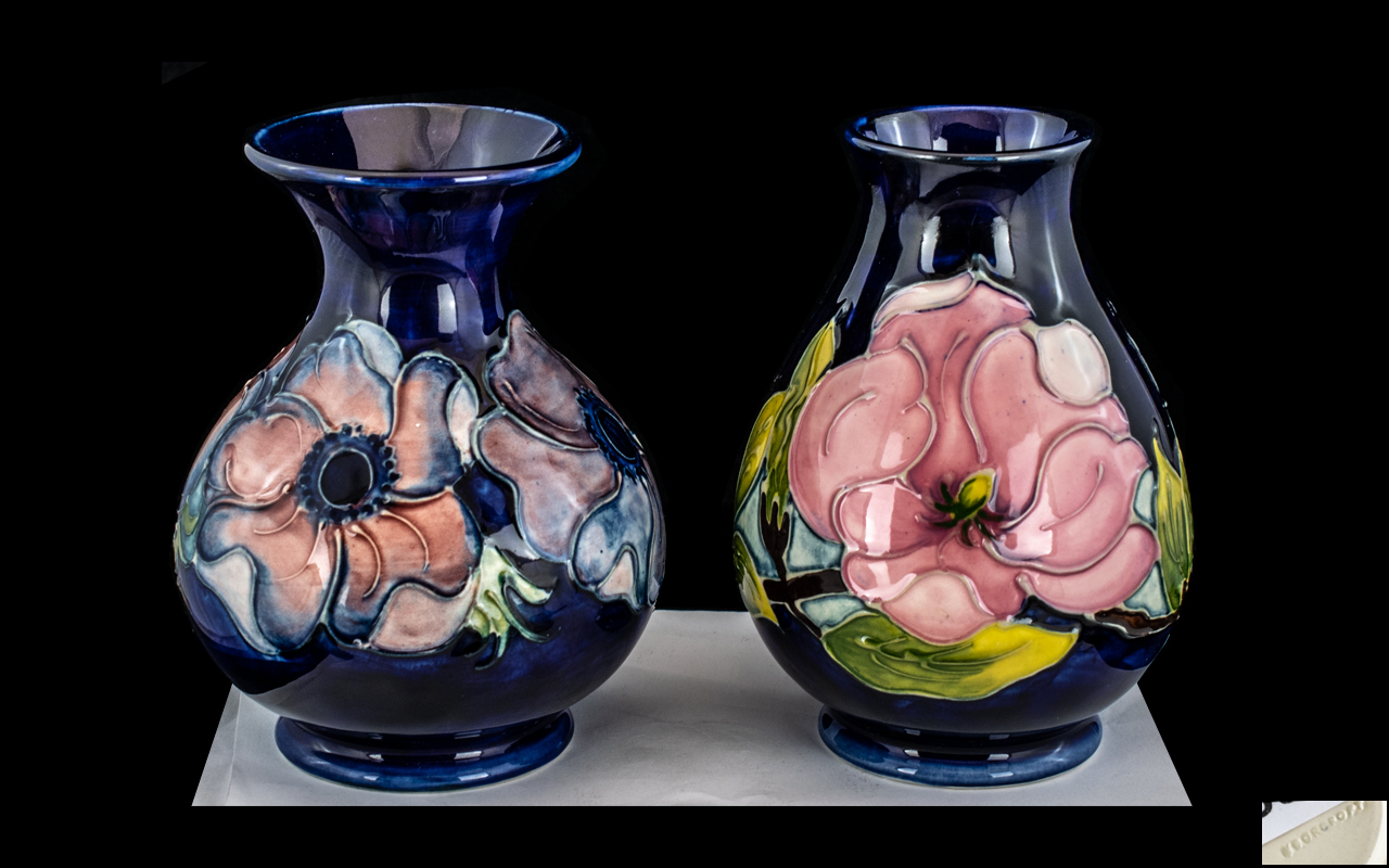 Moorcroft Tube lined and Hand Painted Pair of Globular Shaped Vases.