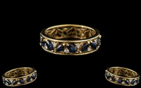 18ct Gold Sapphire & Diamond Eternity Ring. Continuous row of marquis cut sapphires with diamond