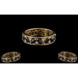 18ct Gold Sapphire & Diamond Eternity Ring. Continuous row of marquis cut sapphires with diamond