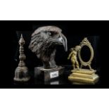 Cast Bronze Head of an Eagle, mounted on a square plinth, 8 inches (20cms) high,